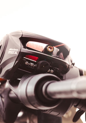 Close-up of an Abu Garcia MAX baitcasting fishing reel on a blurred background